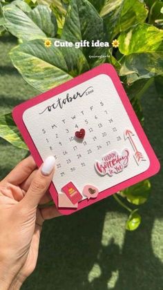 someone is holding up a calendar card