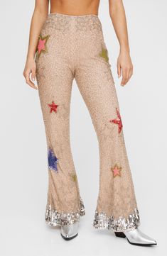 Step out in bold, glamorous style in these elaborately beaded flare-leg pants adorned with sparkly sequins and vibrant stars. Exclusive retailer Hidden side-zip closure 100% polyester Dry clean Imported Cowgirl Pants, Disco Cowgirl, Going Out Trousers, Disco Pants, Clubbing Outfits, Honeymoon Outfits, Spring Break Outfit, Formal Wear Dresses, Flare Pant