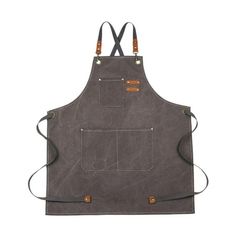 an apron with two pockets and straps on the front, one is grey and has brown leather