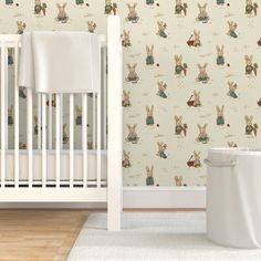 a baby's room with a crib and wallpaper