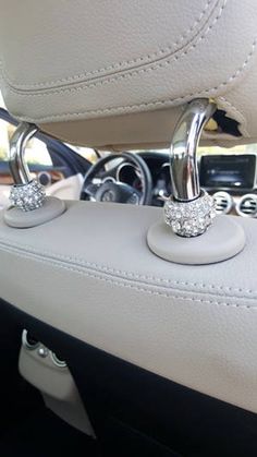 the interior of a car with two diamond - encrusted rings on it