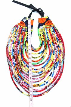 Priceless Culture makes you stand alone with this amazing African Print Multi-strand necklace!! Make a bold statement and stand out of the crowd!! You're sure to get all the attention with these beautiful African Jewelry!! View Jewelry on Model: https://www.etsy.com/listing/535128413/african-print-multistrand-necklace?ref=shop_home_active_1 This jewelry are awesome fashion accessory for any event, occasion and even to the office. Your bridesmaids will shine in these earrings and they make great African Accessories, Afrikaanse Mode, African Necklace, Set Apart, Fabric Necklace, Printed Jewelry, African Wax Print, Textile Jewelry, African Jewelry