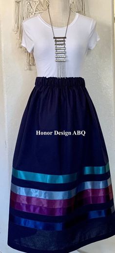 "THE CHROMATIC COLLECTION - Traditional Ribbon Skirt for winter in navy blue with five exquisite satin ribbons in teal, plum, amethyst, steel blue and teal colors finished with elevated details and lovingly made by hand. A paper bag waist hugs the body, while also being comfortable to wear. See our sizing details below.  Ready to ship! A long time symbol femininity, sisterhood and solidarity, used in ceremony and everyday, every skirt tells a story written by the woman who wears it. Perfect for every season, dressed up or down. Satin ribbons adorn our skirts and are chosen and arranged by hand during the design process. Each skirt is one of a kind, and may be the only skirt available in the indicated size, fabric, and ribbon combination. We recommend buying the skirt before it sells out, w Blue Ribbon Skirts Native American, Metis Ribbon Skirt, Ribbon Skirt Outfit, Ribbon Skirts Pattern, Ribbon Skirts Native American, Native American Ribbon Skirt, Native American Style Outfits, Time Symbol