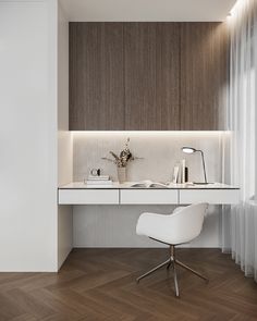 a white chair sitting in front of a desk with a lamp on top of it