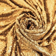 gold sequins on fabric close up in sepia tone