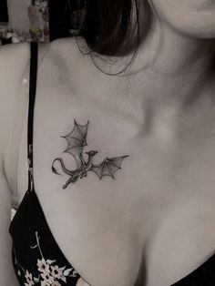 a woman with a tattoo on her chest