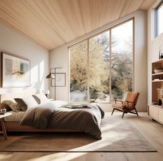 a bedroom with large windows and a bed in the middle, surrounded by wooden flooring