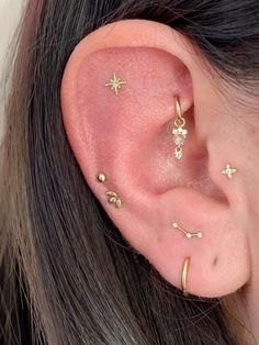 an ear with three tiny stars on it