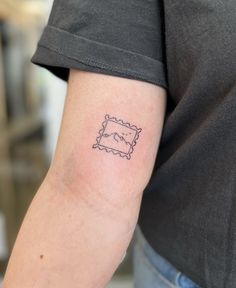 a person with a small tattoo on their arm