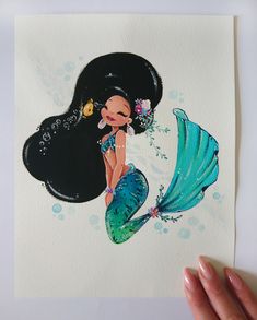 a watercolor drawing of a mermaid with long black hair and a flower in her hair