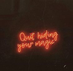 a neon sign that says out hiding your magic