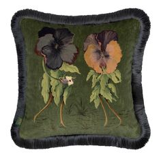 a green pillow with two flowers on the front and one flower on the back,