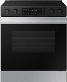 a stainless steel oven with the door open and an electronic timer on it's side