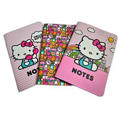 three notebooks with hello kitty designs on them