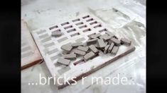 some bricks are laying on top of a table and the words bricks made above them