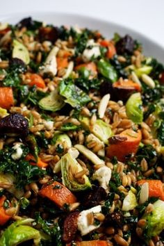 a white bowl filled with rice and vegetables