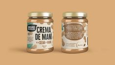 two jars of peanut butter sitting side by side on a brown background with the words crema de main