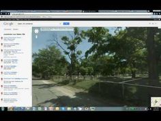 an image of a google street view with trees in the background