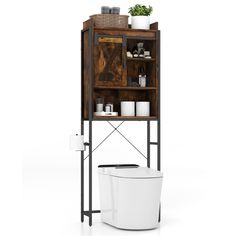 the toilet is next to a wooden cabinet with shelves above it and a plant on top