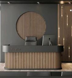 the reception desk is decorated with wood slats and an embossed circle on the wall