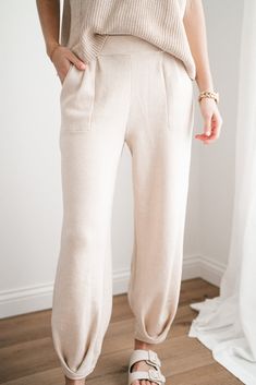 Elevate your wardrobe with the Della Sweater Lounge Set - Pants. These cozy pants are designed with a slight barrel style bottom, offering a relaxed yet stylish silhouette that's perfect for unwinding at home or stepping out for errands or a date night. With convenient pockets and a comfortable fit, these pants combine function with effortless style. Pair them with the matching top for a complete look that's as comfortable as it is chic. Fabric: 85% Polyester 15% Linen The Fit: Flowy, comfortabl Sweater Lounge Set, Sweater Lounge, Cozy Pants, Loungewear Dresses, Comfortable Sweater, Sweater Material, Stepping Out, Short Leggings, Lounge Set