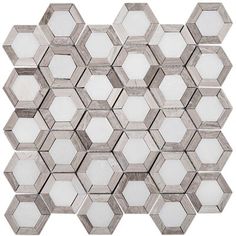 a white and grey hexagonal tile pattern on a white background, with small squares in the middle