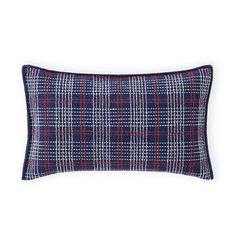 a blue and red plaid pillow on a white background