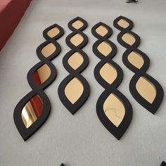 there are many mirrors on the table with different shapes and sizes to choose between them