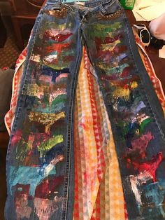 Custom made hand painted jeans with cows. Hand Painted Denim Pants, Artistic Straight Leg Denim Jeans, Artistic Hand Painted Straight Leg Bottoms, Home Made Cow Print Jeans, Cow Print Patchwork Jeans, Bell Bottom Jeans Cow Print, Graffiti Clothes, Artistic Hand Painted Denim Jeans, Artistic Hand Painted Denim Bottoms