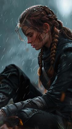 a woman with braids sitting in the rain