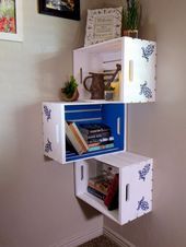 three boxes stacked on top of each other in the corner of a room with pictures above them