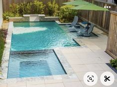 a small pool with chairs and an umbrella in the back yard, next to a wooden fence