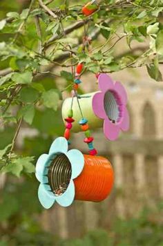 colorful wind chimes hanging from a tree branch