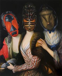 three women with masks on their faces and one woman holding an object in her hand