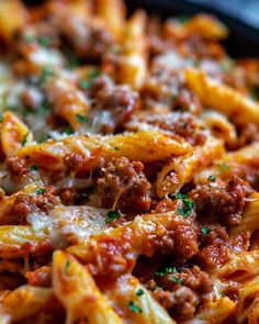 pasta with meat sauce and cheese in a skillet, ready to be eaten or served