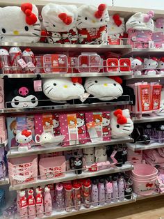 hello kitty merchandise on display in a store with pink and white accessories for the girls