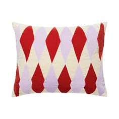 a red and white pillow with an argyle pattern on the front, sitting against a white background