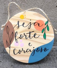 a wooden sign that says seja forte e coragoso