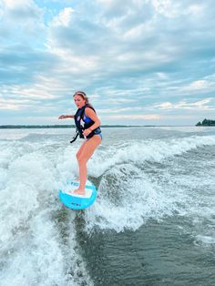 a woman on a surfboard in the water