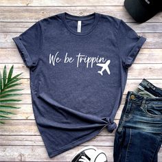 We Be Trippin Tshirt, Travel Sweater, Adventurous Vacay Tee, Vacation Gift, Family Vacation Tshirt, Vacay Mode Crewneck, Girls Trip Shirts How to Order?  1-Choose your t-shirt color, 2- Choose your size, 3- Select the quantity, 4- Click Add to Cart.  Production and shipping: * 100% airlume combed and ring-spun cotton, 32 singles 4.2 oz. * Solid colors are %100 cotton * Heathers are %52 cotton %48 polyester * Athletic Heather is combed and ring-spun cotton, 10% polyester * Seamless collar * Heat Group Travel Shirts Ideas, Vacation Shirt Ideas, Vacation Tee Shirts, Family Vacation Tshirt, Vacation Shirts Family, Funny Vacation Shirts, Funny Vacation