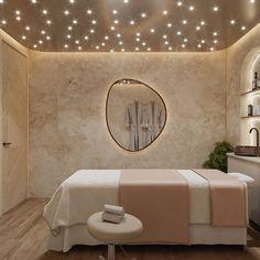 a room with a bed, mirror and lights on the ceiling