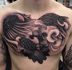 a man with an eagle tattoo on his chest