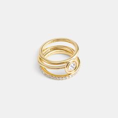 This set of stackable rings add a touch of sparkle to any look. It includes one polished band one pavé band and a bezel-set crystal ring. Wear together or separately. | Coach Halo Round Ring Set - Women's Size 8 - Gold Pave Band, Gold Ring Sets, Round Rings, Crystal Ring, Crystal Rings, Stackable Rings, Women Accessories Jewelry, Womens Jewelry Rings, Bezel Setting