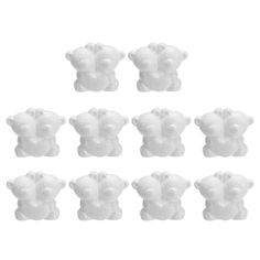 six white teddy bears are arranged in the shape of an elephant's head on a white background