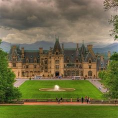 a large building with a fountain in front of it