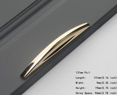 a close up of a metal object on a white surface with measurements for the length