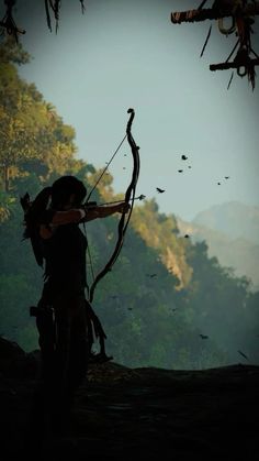 a woman with a bow and arrow in the woods, looking at birds flying overhead