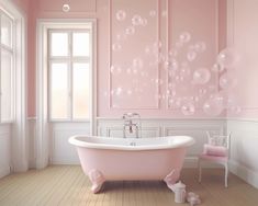 a bathroom with pink walls and wooden floors, an old fashioned bathtub in the center