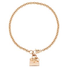 Stylish Hermes Birkin Amulette diamond bracelet in 18 karat gold. This delicate chain bracelet is part of Hermes popular Amulettes collection and features a delightful Birking bag shaped charm. The bracelet glows with radiance of high-polish rose gold and features a sparkling round brilliant diamond hanging off the bag in the manner of famous Hermes bag charms. Enchanting clasp is designed as a Birkin bag lock with inserted key. Hermes does not make the Birkin version of this bracelet any longer Bag Lock, Style Français, Moda Paris, Hermes Box, Bag Charms, Famous Fashion, Delicate Chain, Tres Chic, Hermes Bag