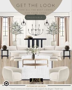 a living room with white furniture and chandelier